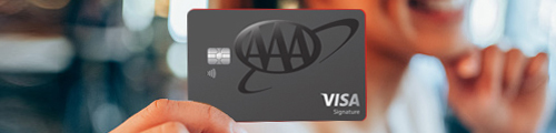 woman holding aaa cashback visa card