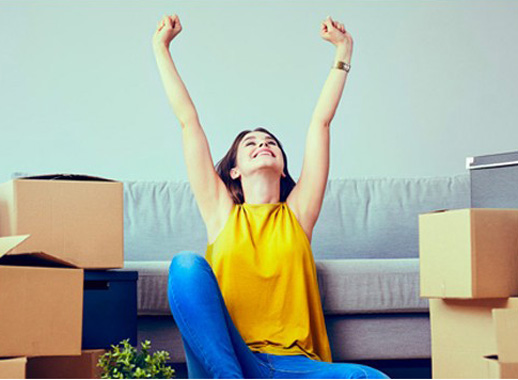 Low-Cost Mortgages - Girl with Mover Boxes