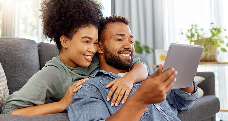 Couple using AAA.com to book next vacation