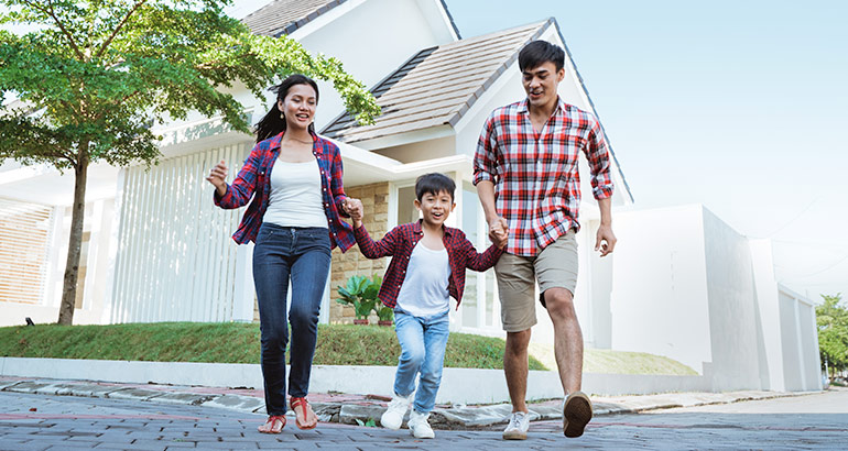 Family walking outside of their house