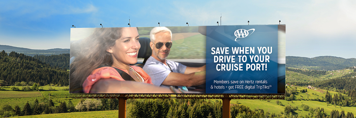 USA Road Trips with AAA and Drive to Cruise billboard with rolling hills behind it