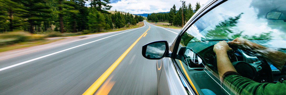 Driver surrounded by mountains