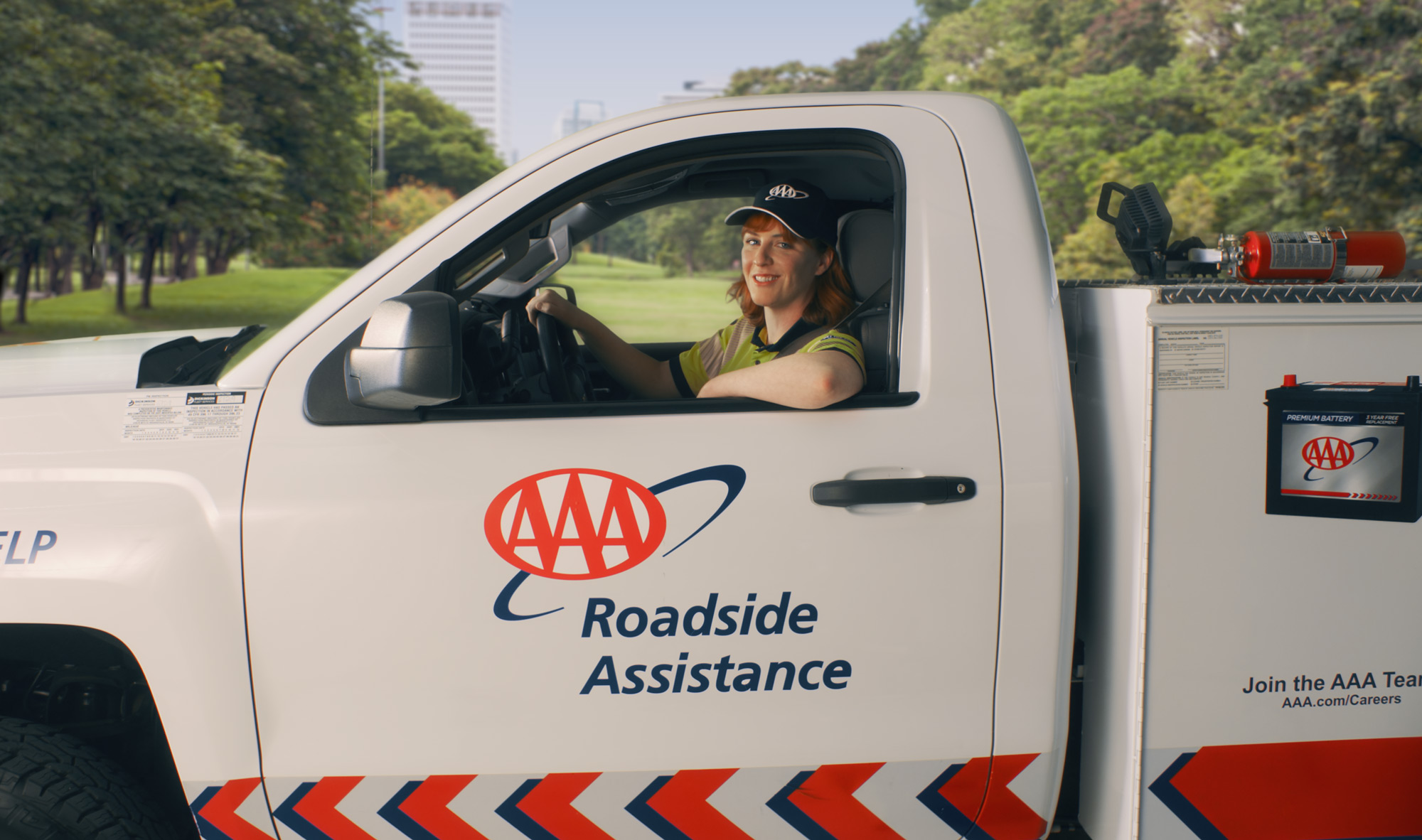AAA roadside expert behind wheel of truck