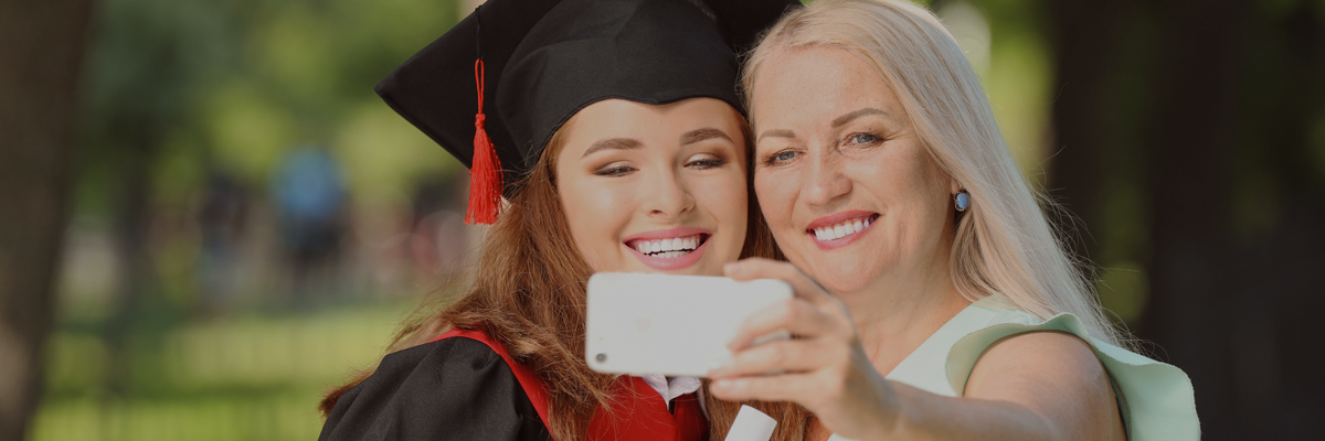 Grandma with graduate taking a selfie
