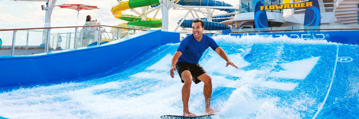 Royal Caribbean guest on Flowrider on a cruise vacation booked through AAA Travel