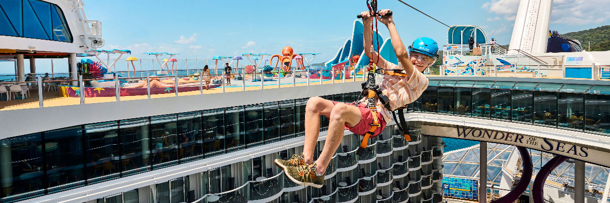 Royal Caribbean guest ziplining on a cruise vacation booked through AAA Travel